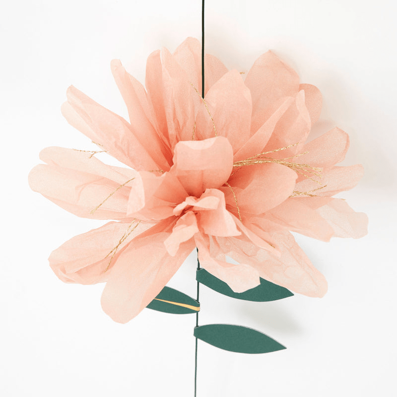 Peach tissue paper flower with gold accents and green leaves for spring from Parte Haus party supply store in Bethesda MD.