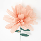 Peach tissue paper flower with gold accents and green leaves for spring from Parte Haus party supply store in Bethesda MD.