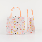 Pastel gift bag with smiley faces rainbows strawberries and flowers birthday theme from Parte Haus party supply store in Bethesda Maryland