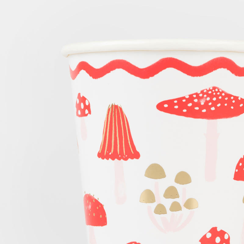 Red mushroom paper cup with whimsical mushroom print woodland theme from Parte Haus party supply store in Bethesda MD