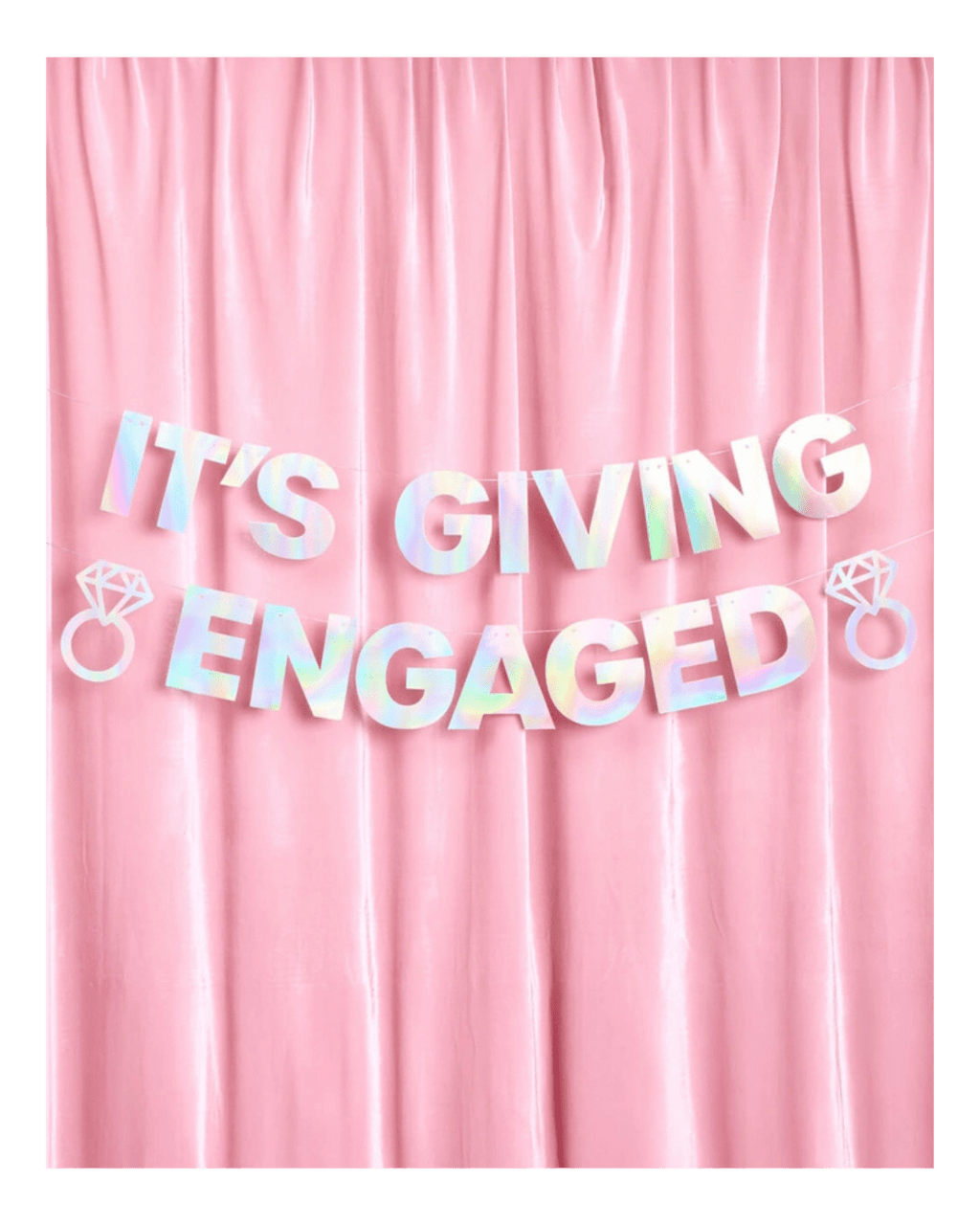 Iridescent engagement banner with diamond ring accents on pink backdrop engagement from Parte Haus party supply store in Bethesda Maryland