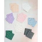 Multicolor bow design napkins elegant striped napkin set holiday theme from Parte Haus party supply store in Bethesda MD