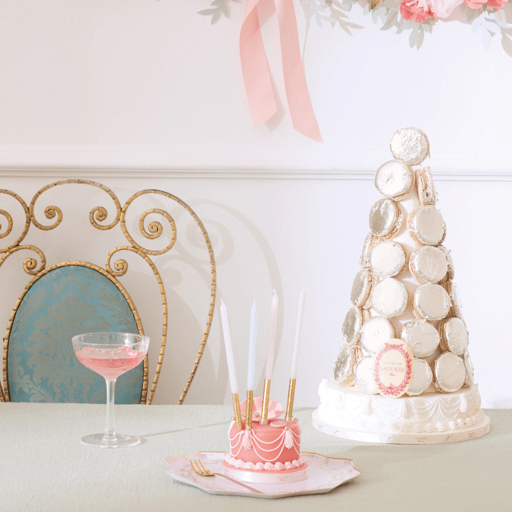 Pink cake birthday candles and white macaron tower dessert table decor from Parte Haus party supply store in Bethesda Maryland