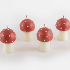 Red and white mushroom candle whimsical decor for woodland party theme from Parte Haus party supply store in Bethesda Maryland.