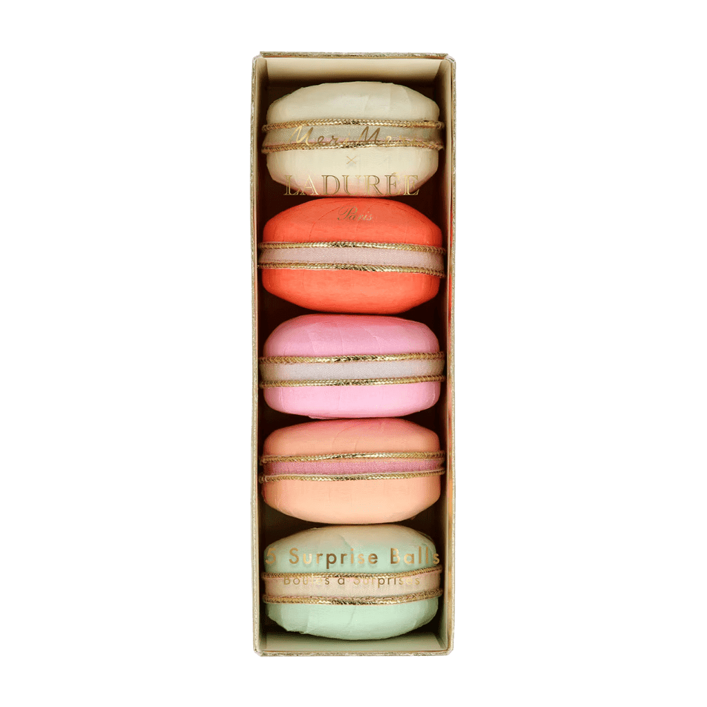 Pastel macaron shaped surprise balls shown in a box birthday theme from Parte Haus party supply store in Bethesda MD