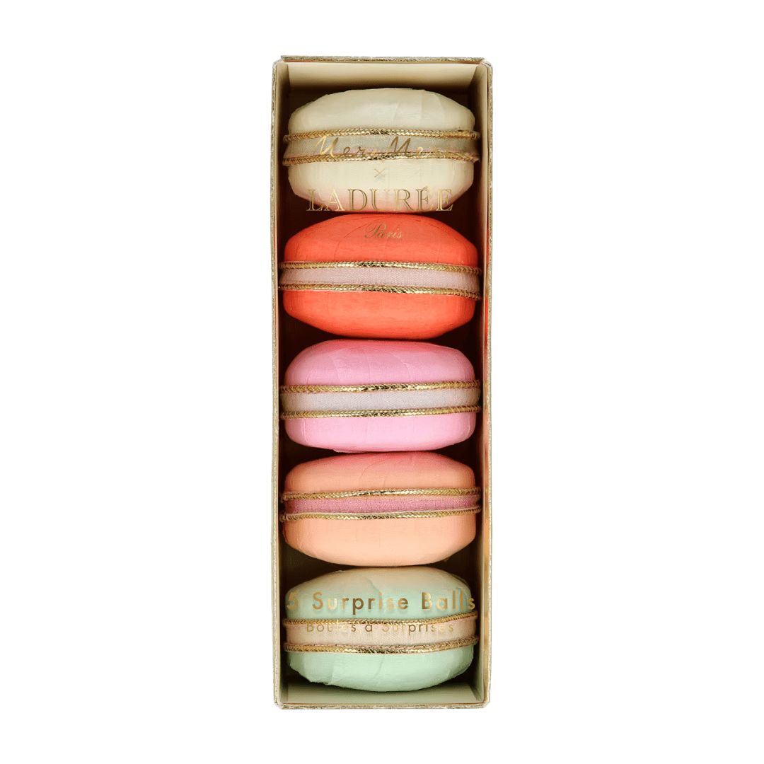 Pastel macaron shaped surprise balls shown in a box birthday theme from Parte Haus party supply store in Bethesda MD