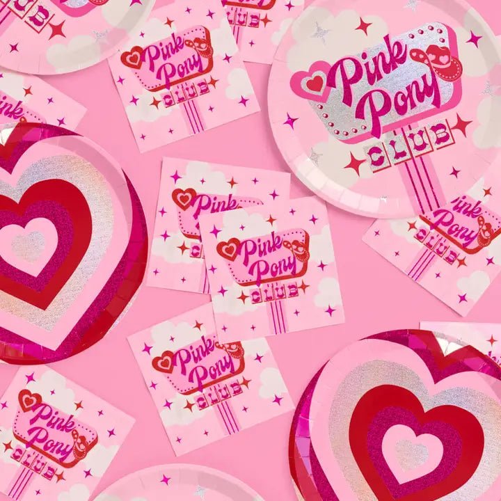 Pink heart plates and Pink Pony Club napkins with sparkly hearts birthday theme from Parte Haus party supply store in Bethesda Maryland