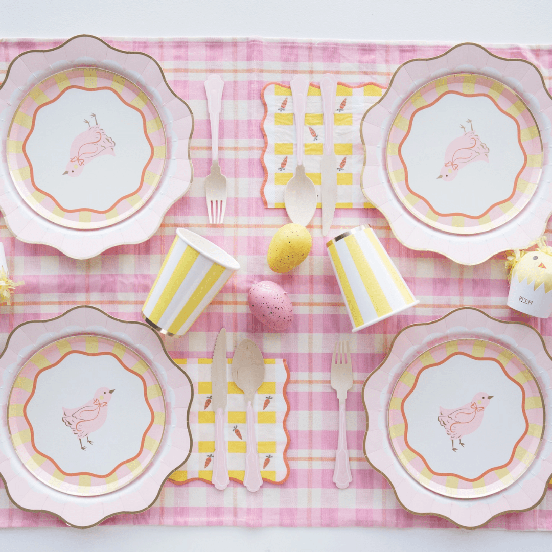 Pink and yellow chick themed tableware with plates cups and napkins for Easter from Parte Haus party supply store in Bethesda MD