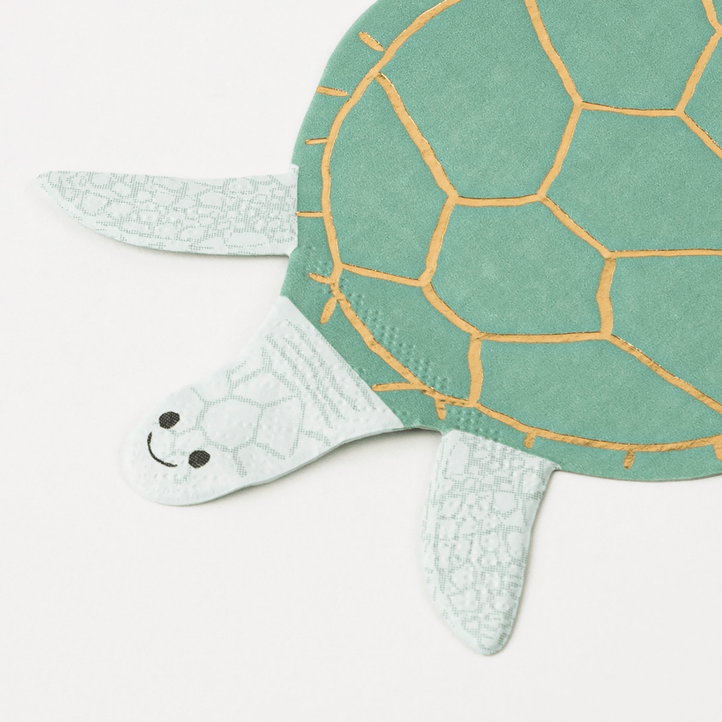 Green turtle shaped napkin with gold shell lines sea theme from Parte Haus party supply store in Bethesda MD