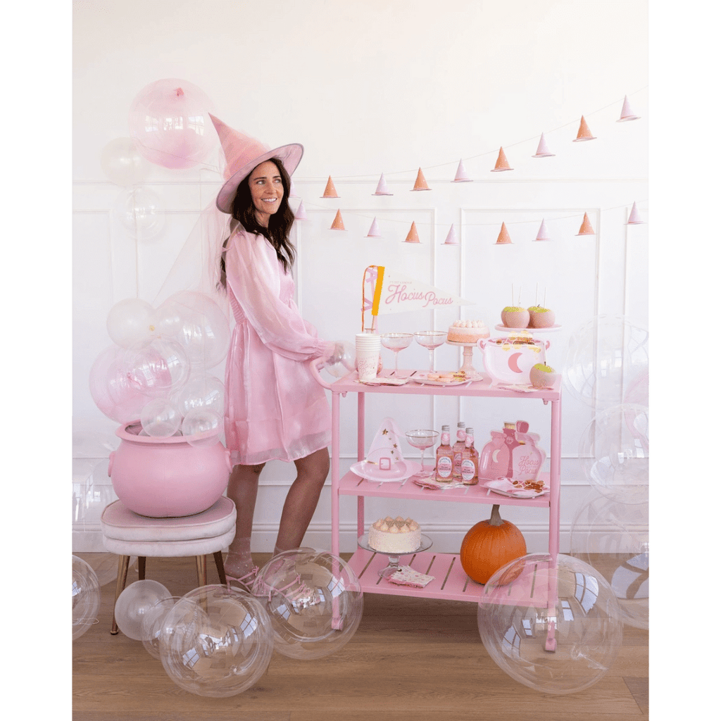 Pink Halloween cart with witch hat balloons and desserts Halloween theme from Parte Haus party supply store in Bethesda MD