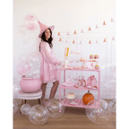 Pink Halloween cart with witch hat balloons and desserts Halloween theme from Parte Haus party supply store in Bethesda MD