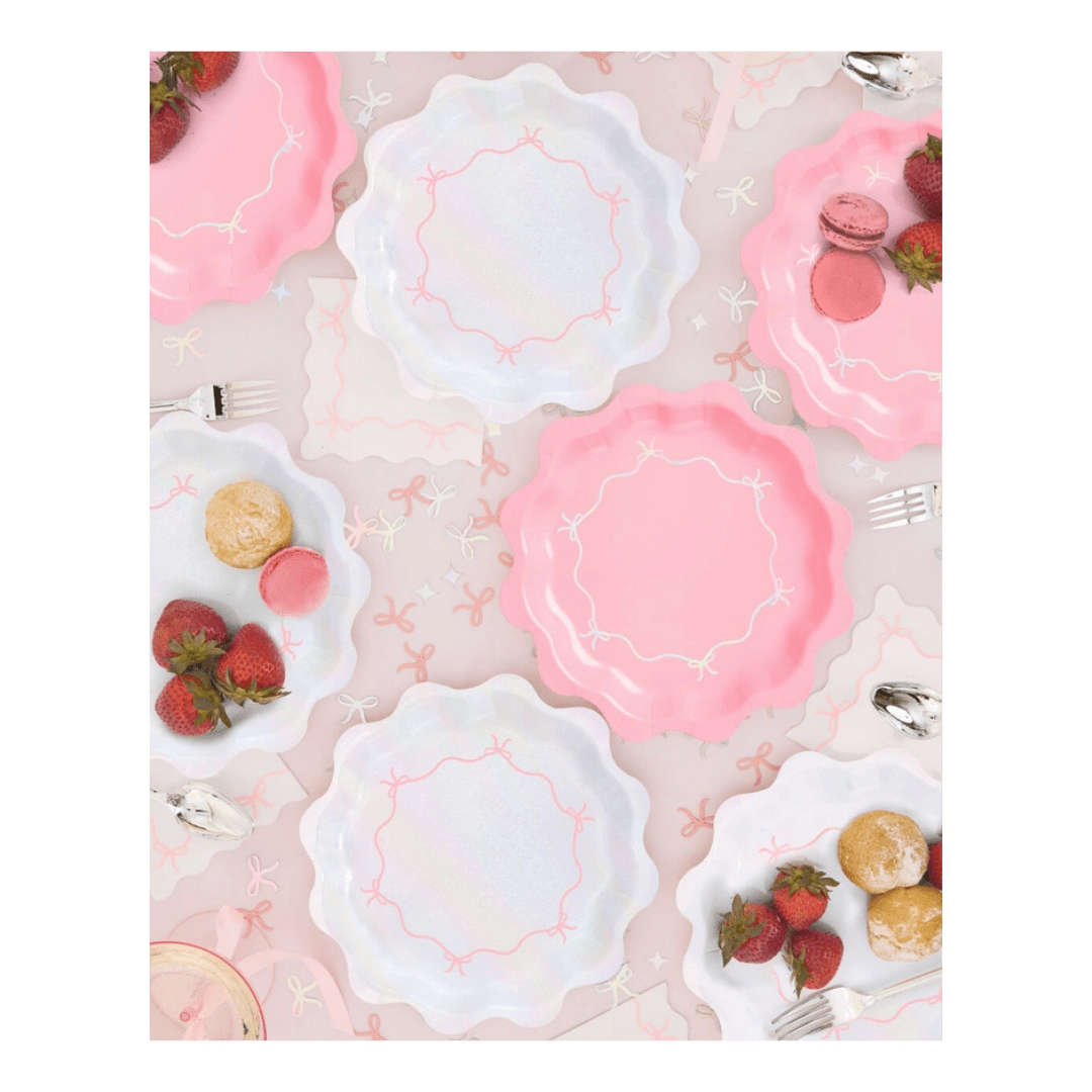 Pink and white scalloped paper plates with bows tea party theme from Parte Haus party supply store in Bethesda Maryland