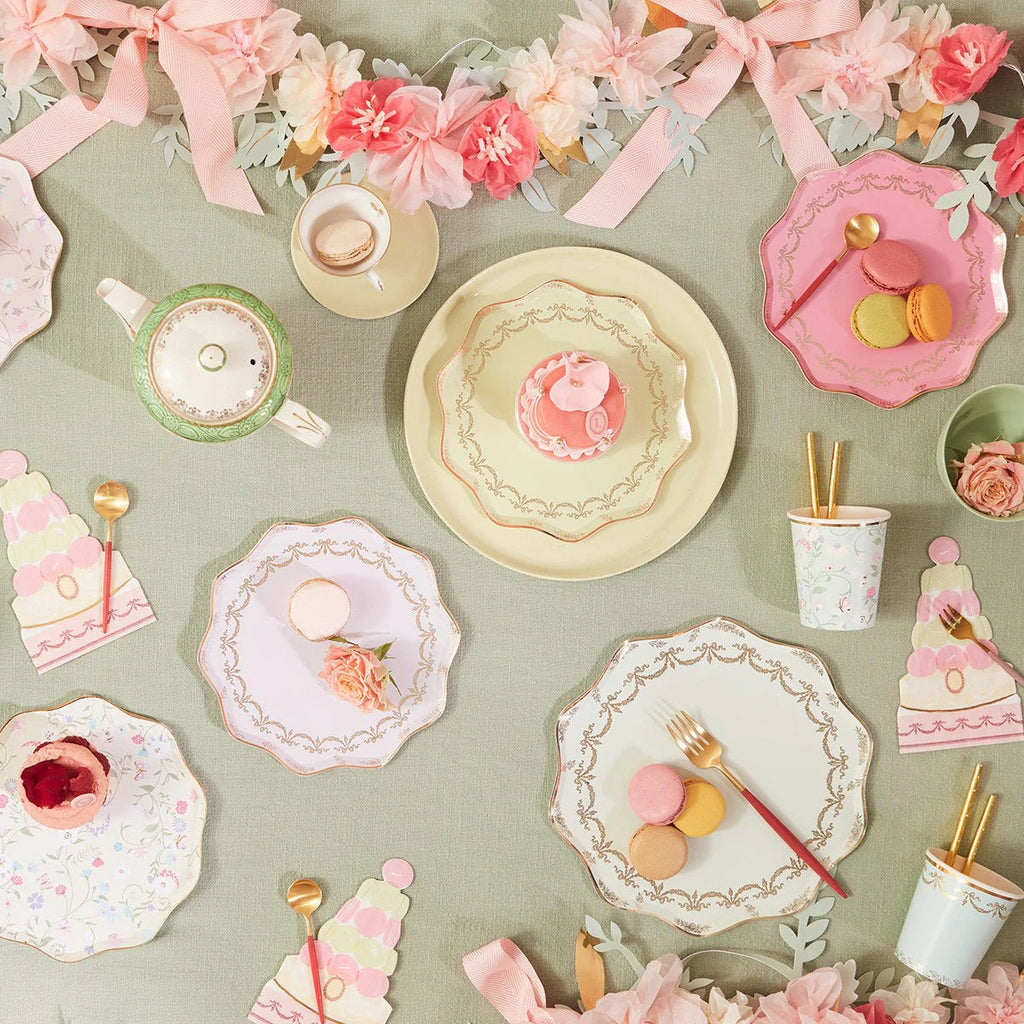 Pastel floral plates and cups with gold cutlery tea party table setting from Parte Haus party supply store in Bethesda Maryland