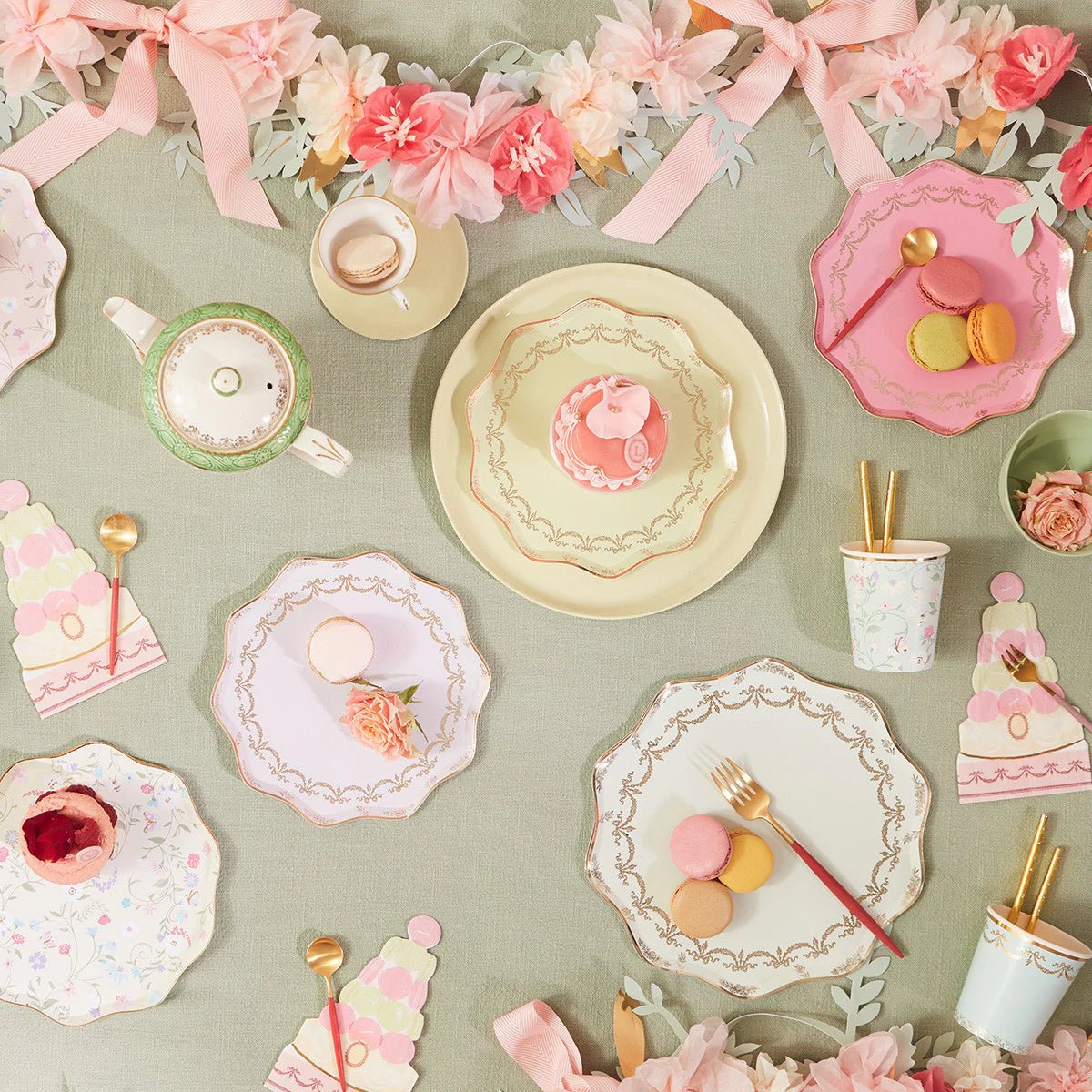 Pastel floral plates and cups with gold cutlery tea party table setting from Parte Haus party supply store in Bethesda Maryland
