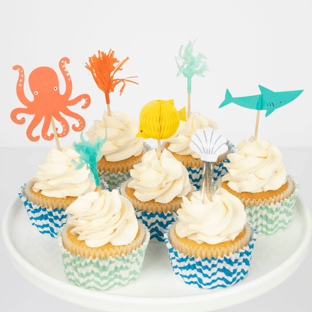 Multicolor ocean cupcake toppers with sea animals on cupcakes Under The Sea theme from Parte Haus party supply store in Bethesda MD