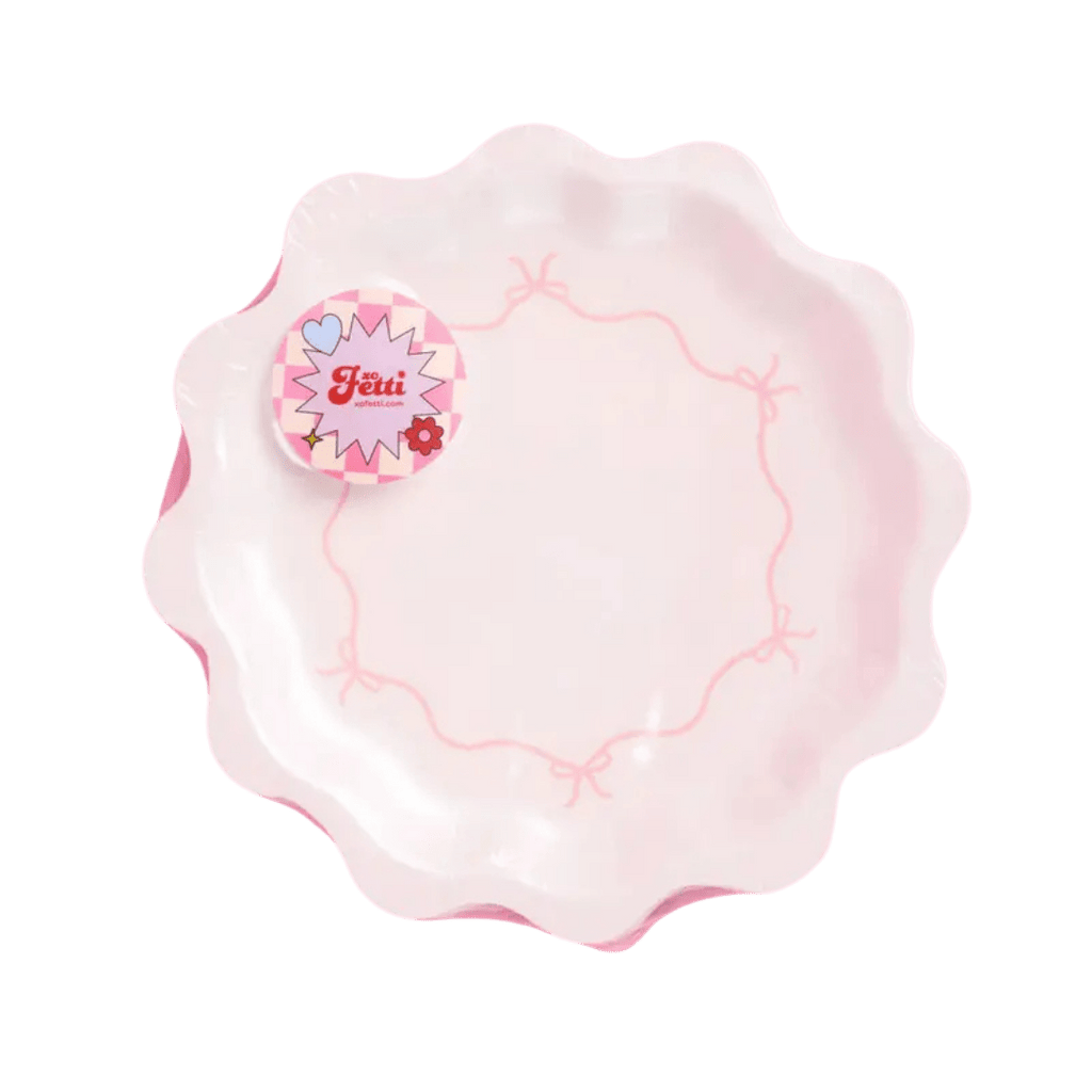 Pink scalloped decorative plate with bow design birthday theme from Parte Haus party supply store in Bethesda Maryland