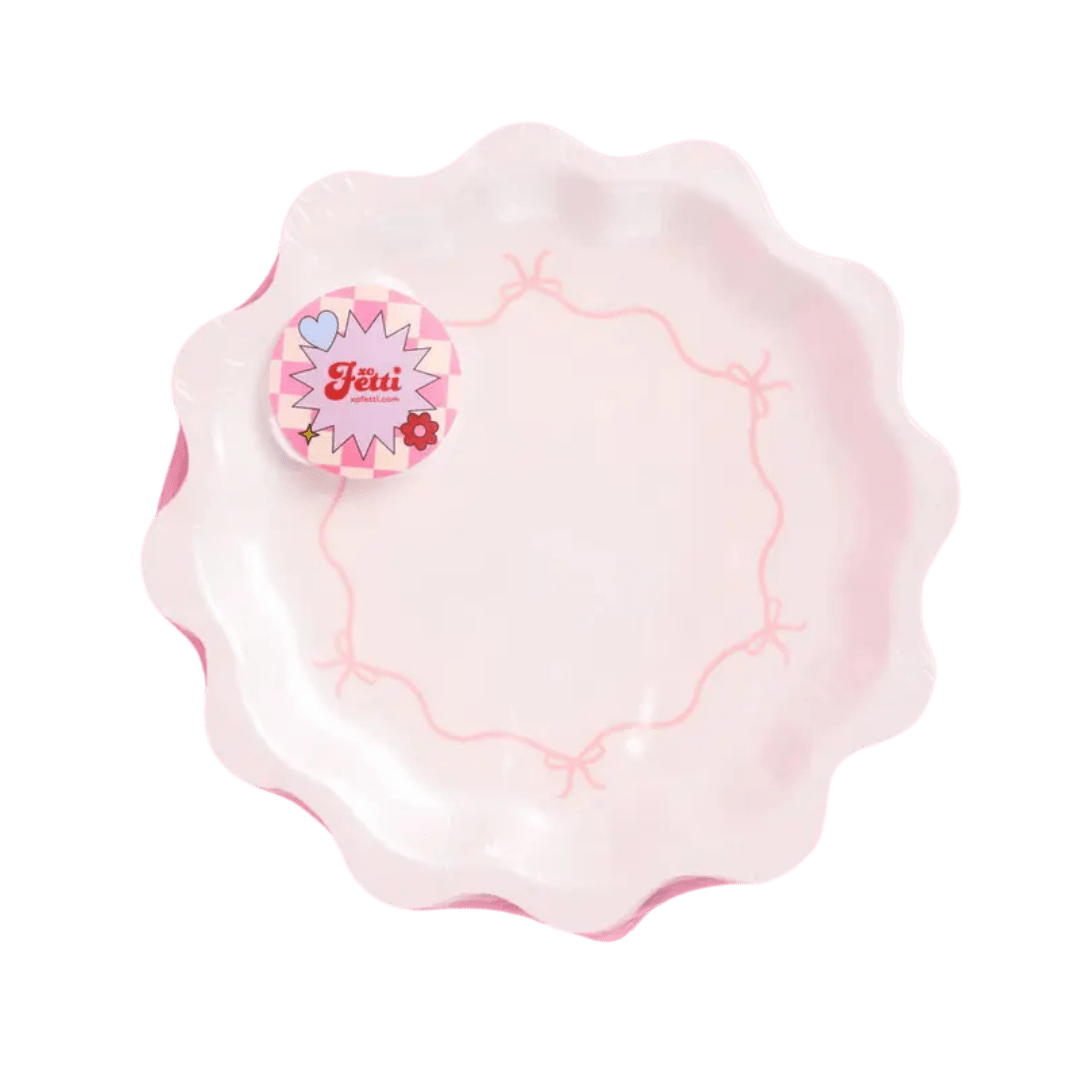 Pink scalloped decorative plate with bow design birthday theme from Parte Haus party supply store in Bethesda Maryland