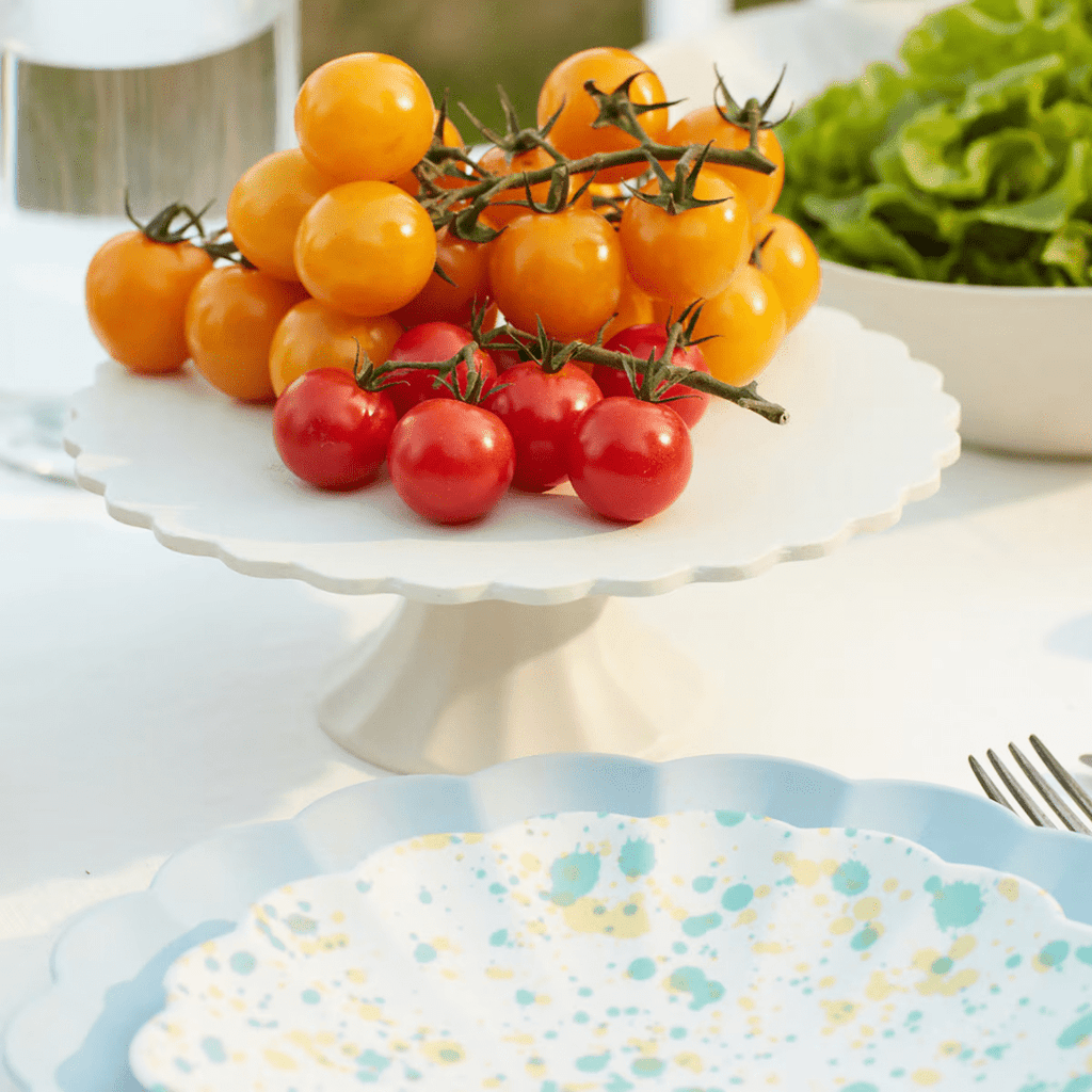 White cake stand with yellow and red tomatoes summer table decor from Parte Haus party supply store in Bethesda MD