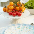 White cake stand with yellow and red tomatoes summer table decor from Parte Haus party supply store in Bethesda MD