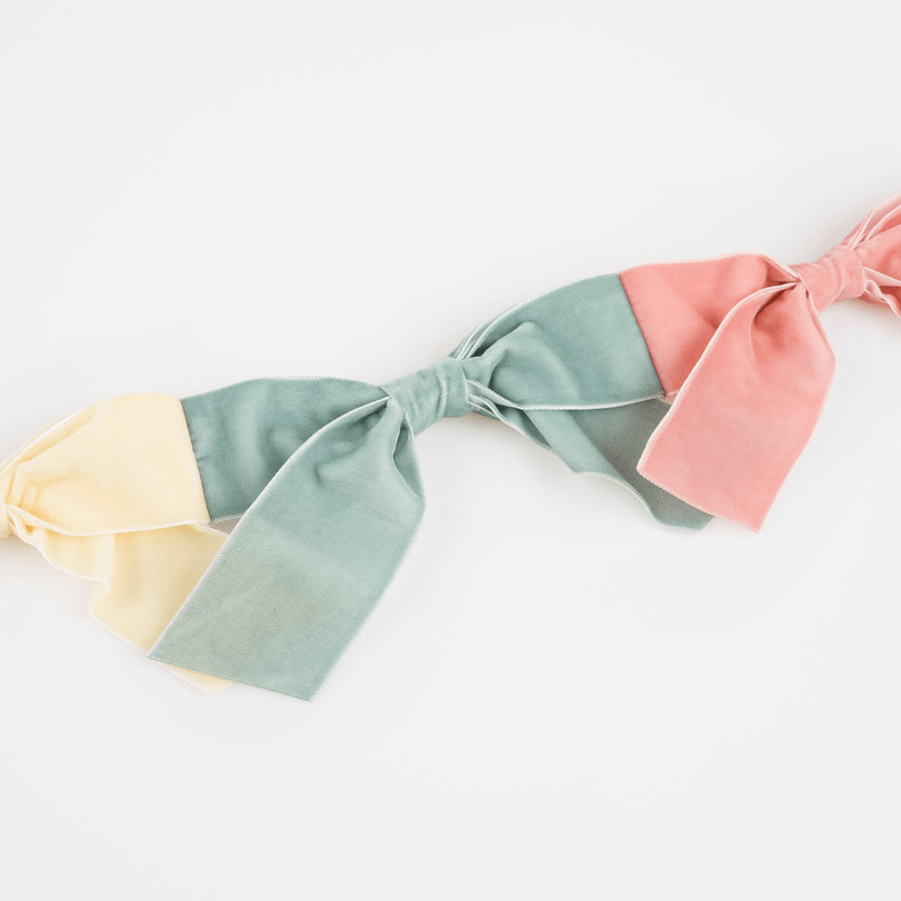 Pastel multicolor fabric bow garland decor for birthday from Parte Haus party supply store in Bethesda MD