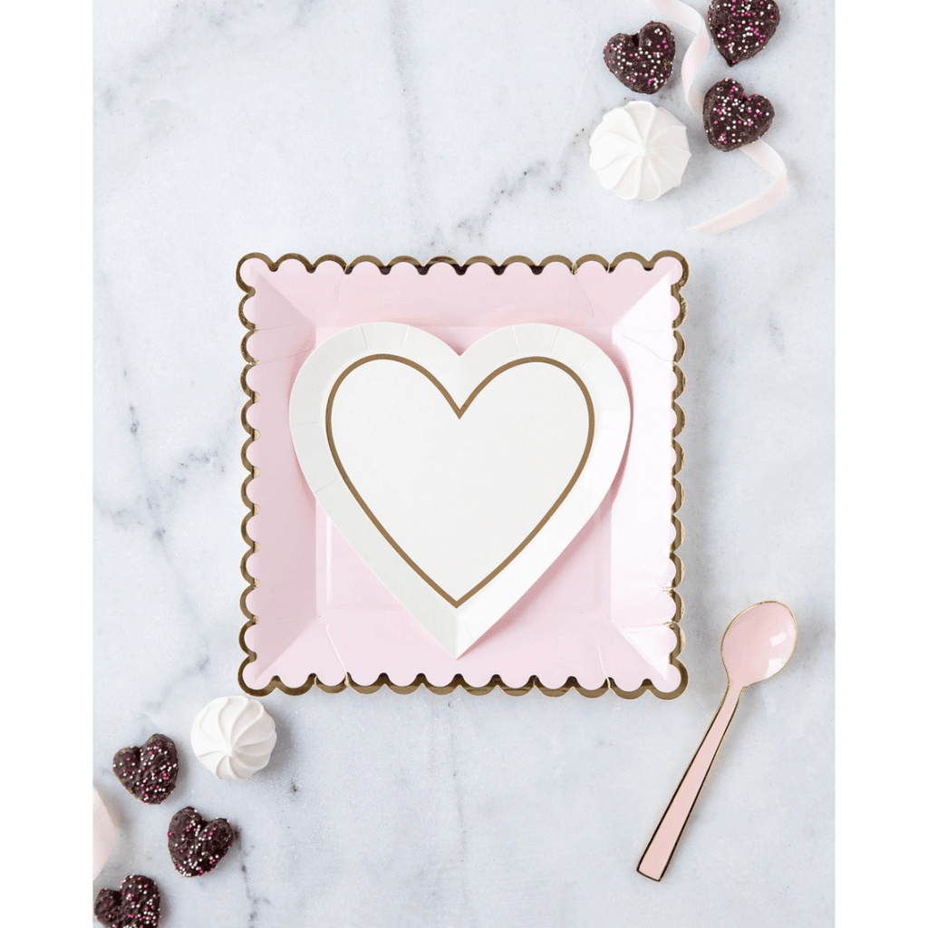 Pink and white heart-shaped paper plate set with gold trim for Valentine's Day from Parte Haus party supply store in Bethesda MD.