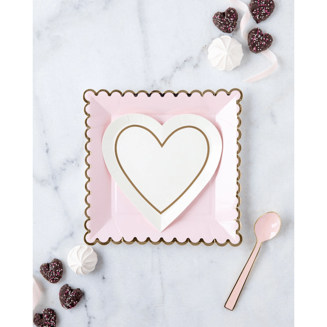 Pink and white heart-shaped paper plate set with gold trim for Valentine's Day from Parte Haus party supply store in Bethesda MD.