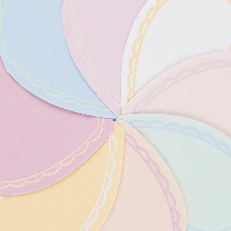 Pastel color scalloped paper plates arranged in a fan for birthday from Parte Haus party supply store in Bethesda Maryland