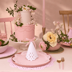 Pink floral cake and pastel party hats birthday table from Parte Haus party supply store in Bethesda MD
