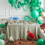 Green dinosaur birthday decoration set with balloons and toys for kids from Parte Haus party supply store in Bethesda Maryland
