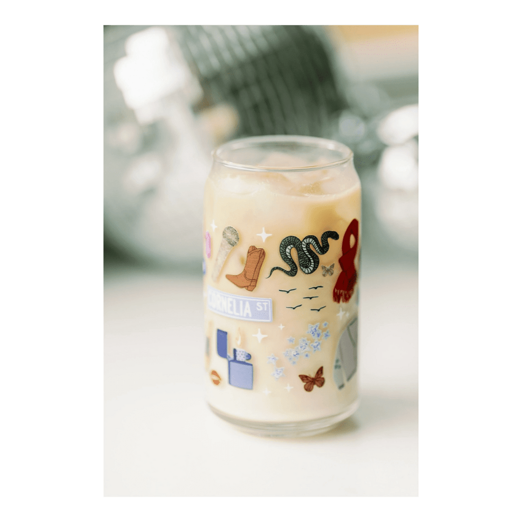 Multicolor custom glass cup with fun sticker icons for celebration theme from Parte Haus party supply store in Bethesda MD.