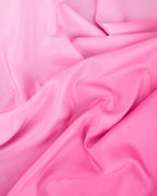 Pink fabric tablecloth smooth and vibrant for birthday from Parte Haus party supply store in Bethesda Maryland