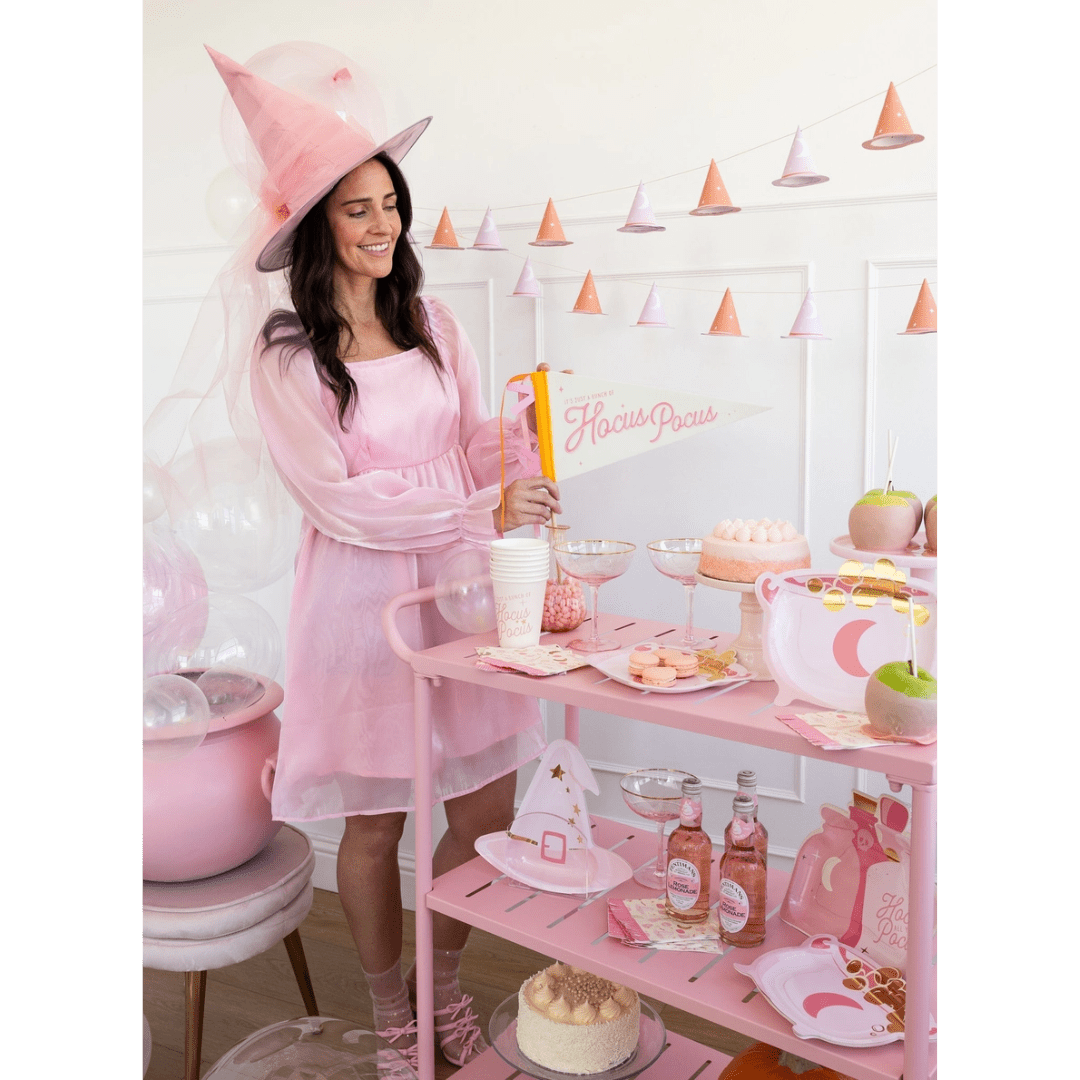 Pink witch costume woman pastel Halloween decor and treats Hocus Pocus from Parte Haus party supply store in Bethesda Maryland