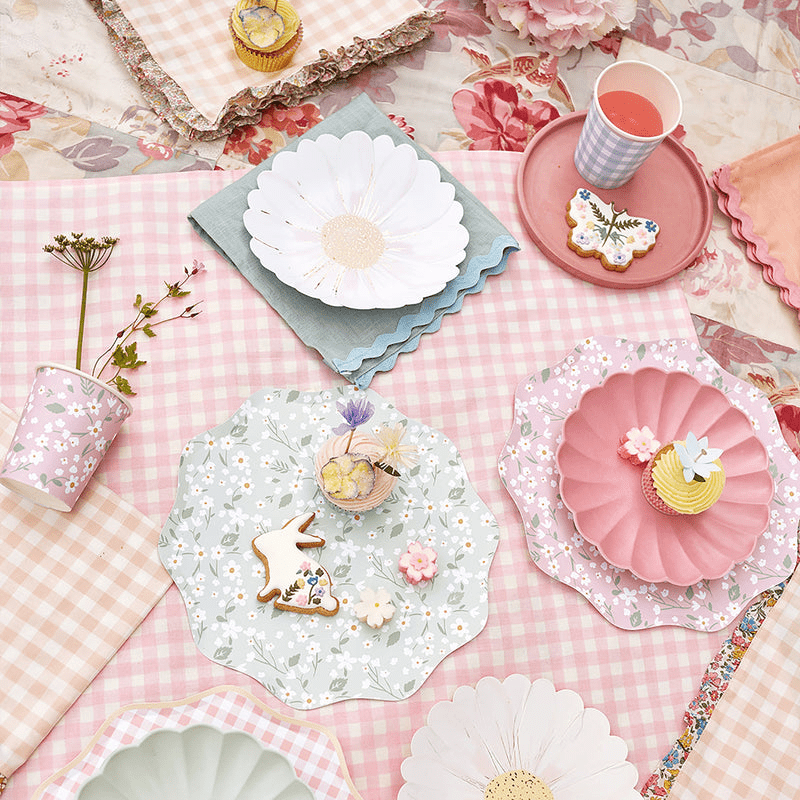 Pastel floral plates scalloped napkins and bunny cookie for spring picnic from Parte Haus party supply store in Bethesda MD