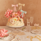 pastel bow cake floral decorations birthday theme from Parte Haus party supply store in Bethesda Maryland