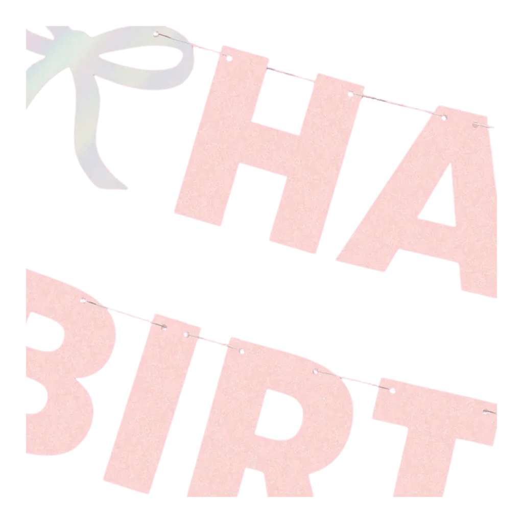 Pink glitter birthday banner with large cutout letters and a bow from Parte Haus party supply store in Bethesda MD.
