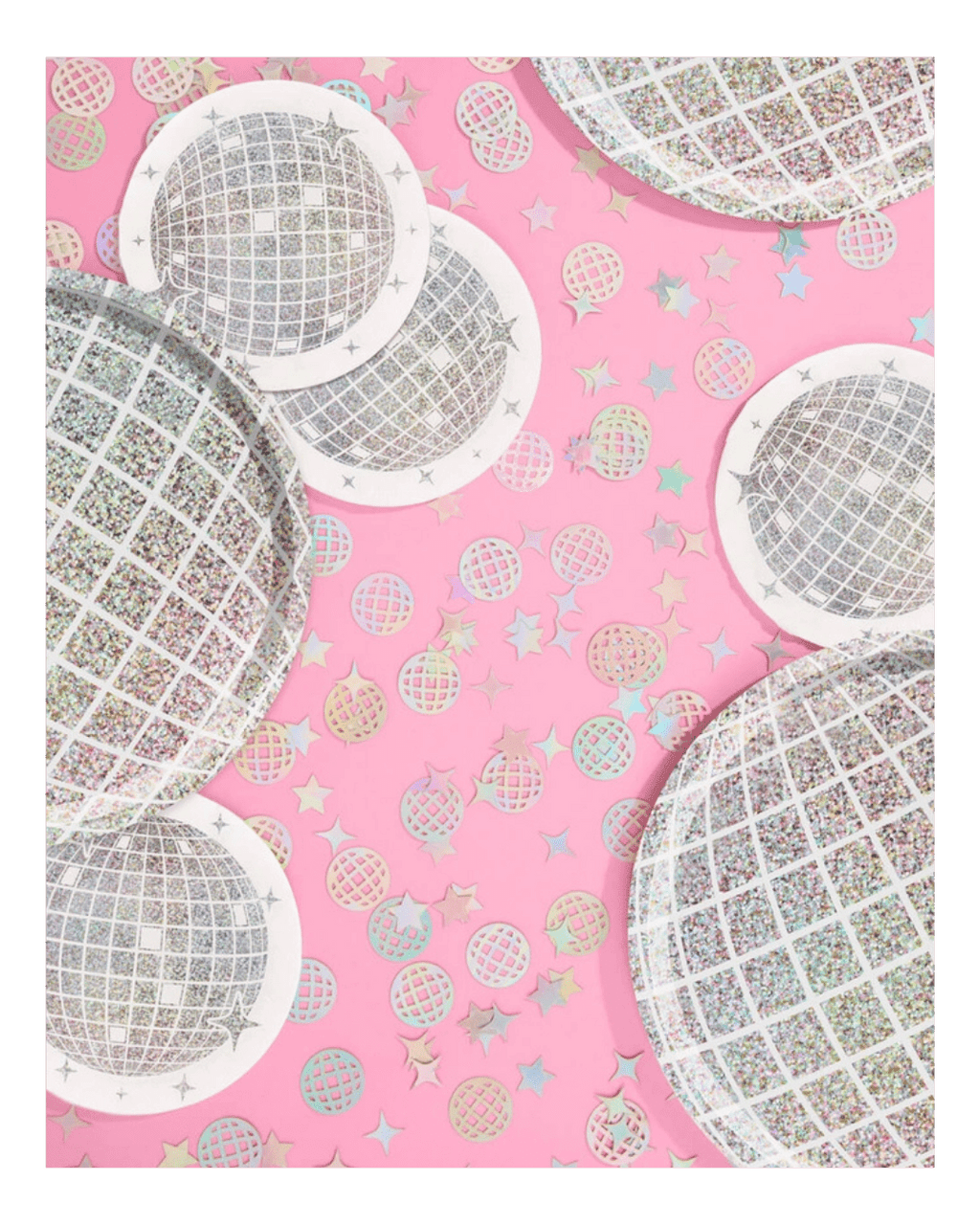 Silver disco ball plates and confetti on pink background disco theme from Parte Haus party supply store in Bethesda MD.