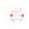 White floral napkin with baby in bloom text baby shower theme from Parte Haus party supply store in Bethesda MD.