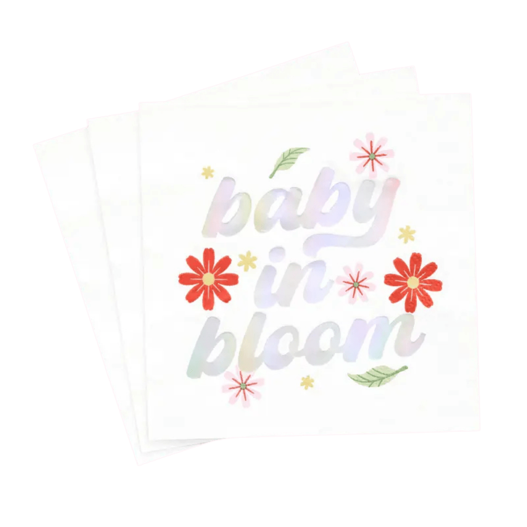 White floral napkin with baby in bloom text baby shower theme from Parte Haus party supply store in Bethesda MD.