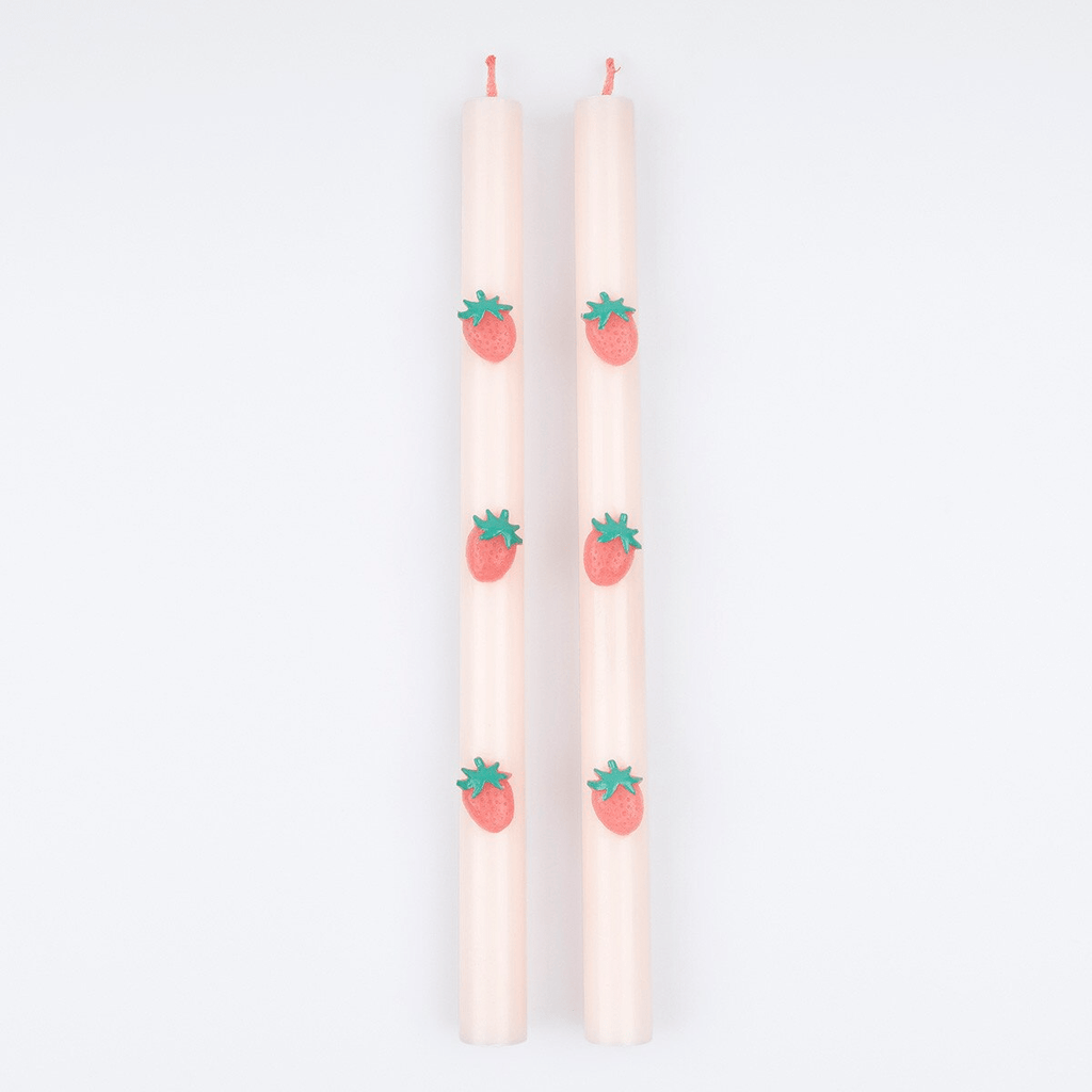 Pink strawberry taper candles with strawberry details summer theme from Parte Haus party supply store in Bethesda MD.