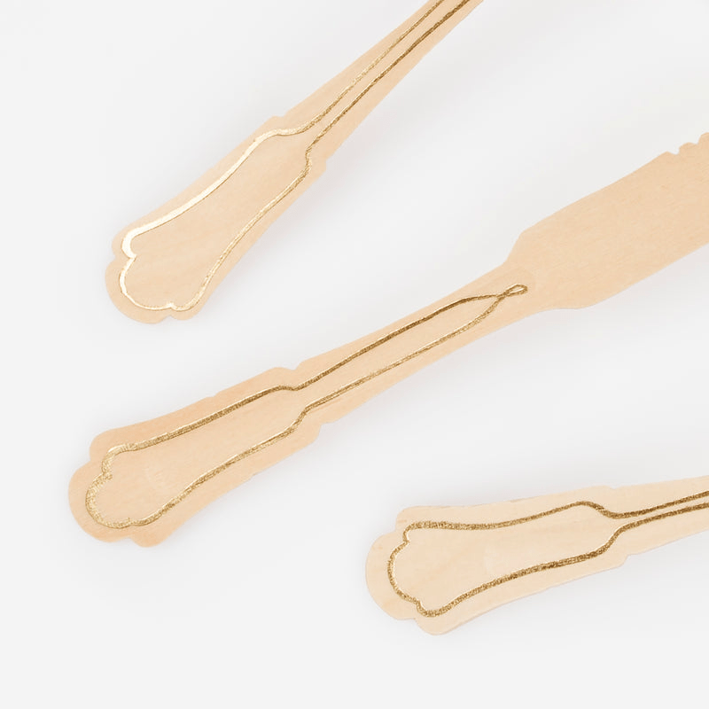 Gold and wood cutlery set with decorative handles elegant event theme from Parte Haus party supply store in Bethesda MD