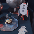 Silver and blue robot cupcake toppers and rocket themed treat bag for space birthday from Parte Haus party supply store in Bethesda MD
