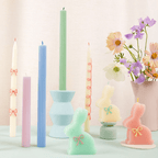 Pastel color decorative bunny and taper candles with bows Easter theme from Parte Haus party supply store in Bethesda MD