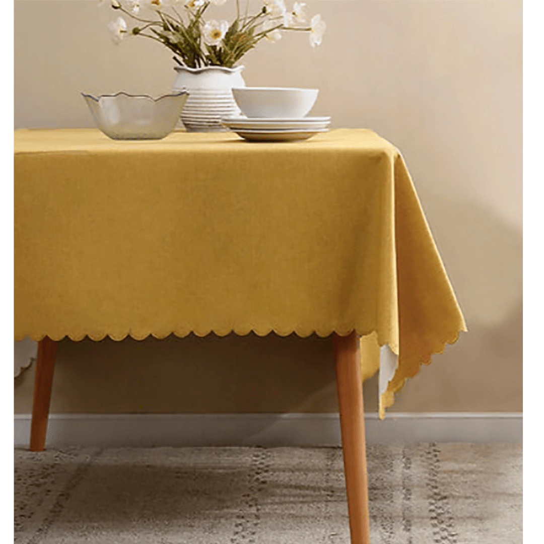 Yellow tablecloth with scalloped edge for modern dinner from Parte Haus party supply store in Bethesda MD