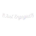 Iridescent Just Engaged banner with diamond ring graphics for engagement theme from Parte Haus party supply store in Bethesda MD.