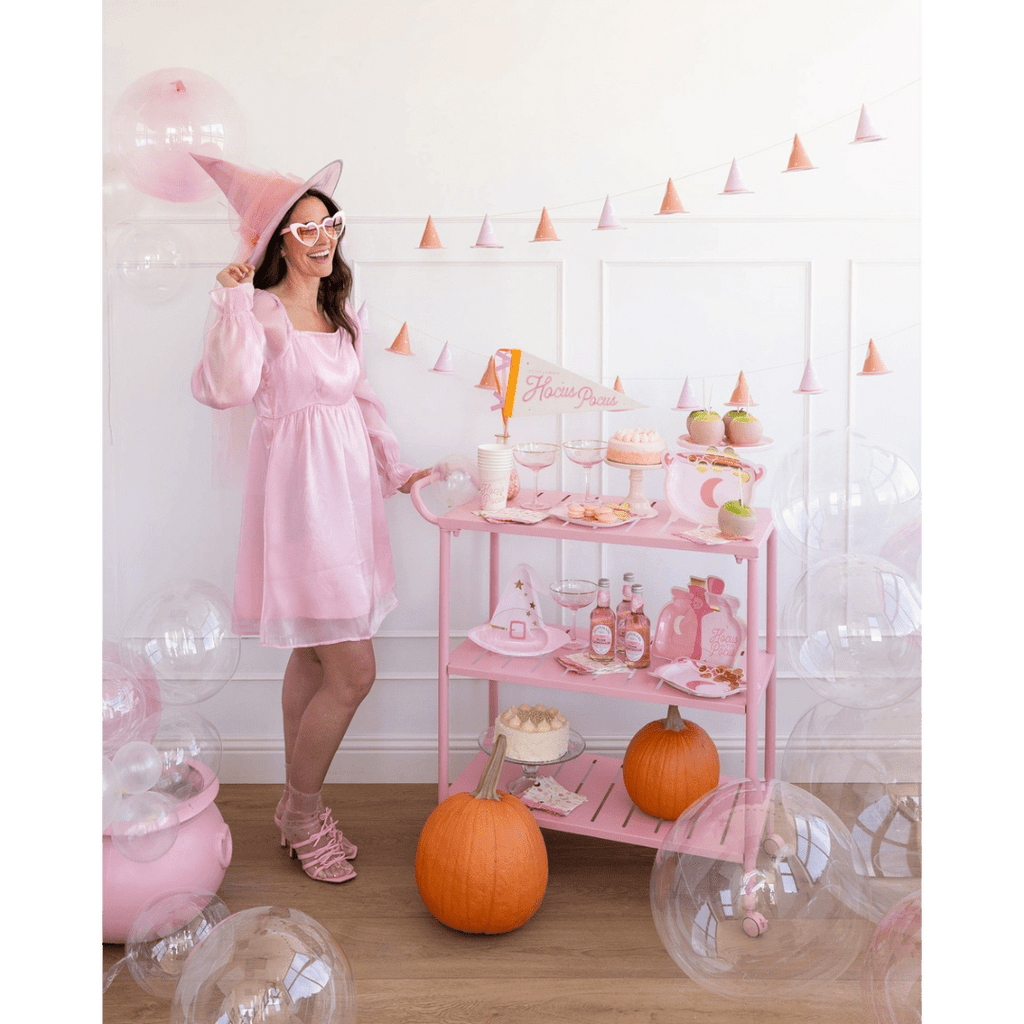 pink Halloween witch costume and decorations pastel pumpkin treats Hocus Pocus theme from Parte Haus party supply store in Bethesda Maryland