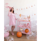 pink Halloween witch costume and decorations pastel pumpkin treats Hocus Pocus theme from Parte Haus party supply store in Bethesda Maryland