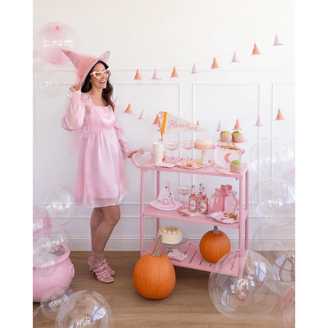 pink Halloween witch costume and decorations pastel pumpkin treats Hocus Pocus theme from Parte Haus party supply store in Bethesda Maryland