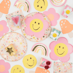 Pink and yellow flower and rainbow plates with cheerful smiley faces kids birthday theme from Parte Haus party supply store in Bethesda MD