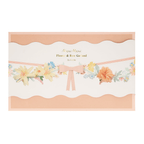 Pastel flower and bow garland with pink ribbon perfect for spring from Parte Haus party supply store in Bethesda MD.