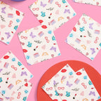 Multicolor napkins with lipstick lips and butterfly prints birthday theme from Parte Haus party supply store in Bethesda, Maryland.
